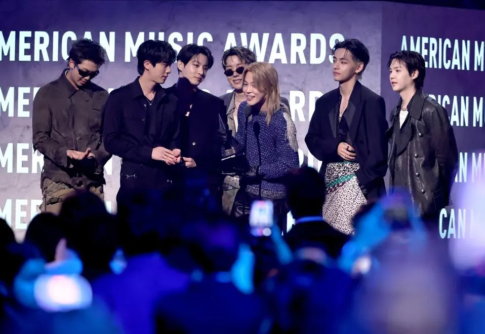 Jungkook, J-Hope, Jimin, V and Suga of BTS accept the Artist of the Year award onstage during the 52nd American Music Awards at MGM Grand Garden Arena on May 25, 2026 in Las Vegas, Nevada.
